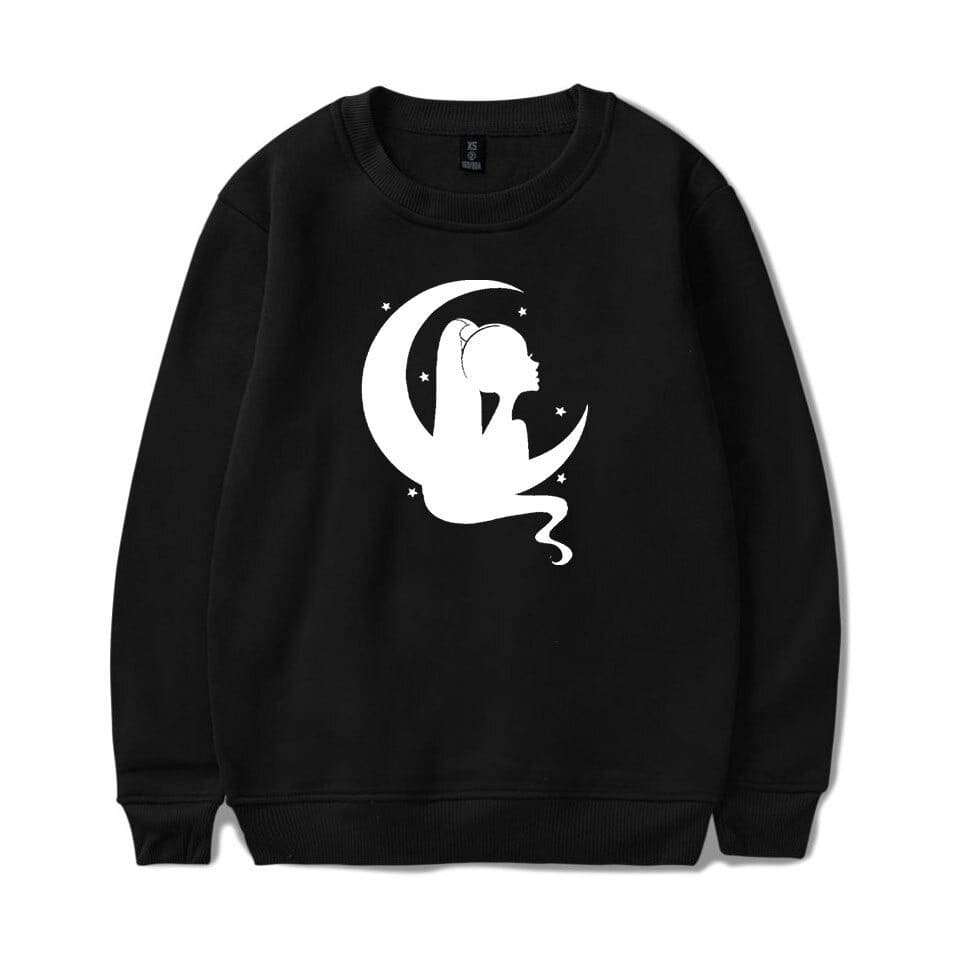 Ariana Grande merch sweatshirt featuring a whimsical silhouette of her sitting on a crescent moon with stars.